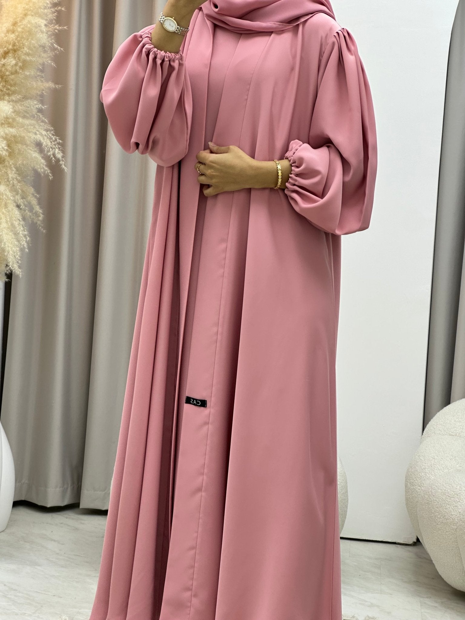pastel abaya dress title If you looking for a pastel color Abaya, we suggest you Marwaa Pink An Abaya Dress, with Organdy Glitter material with full lining. Comes with an abaya cardigan and FREE