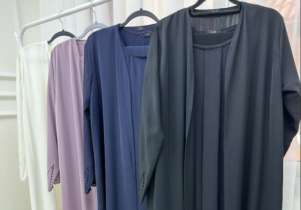 What are the popular abaya fabrics and colors in the UAE - Crystal Abaya Studio