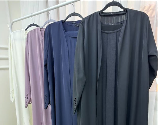 What are the popular abaya fabrics and colors in the UAE - Crystal Abaya Studio