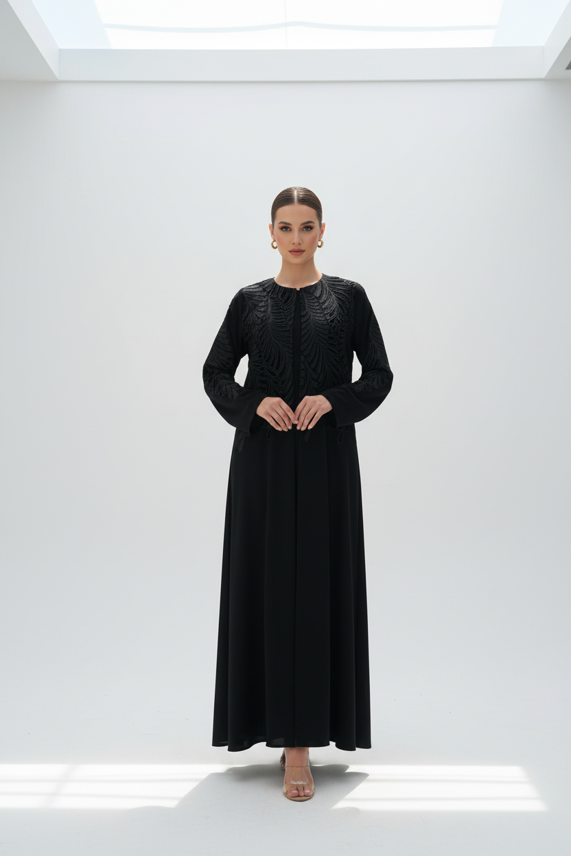 Arab model in feather-embroidered abaya