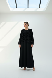 Arab model in printed velvet abaya