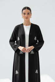 Arab model wearing black abaya - waist-up close-up