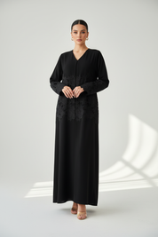 Arab model wearing black abaya with lace on body and sleeves