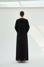 Back view of beaded abaya on model