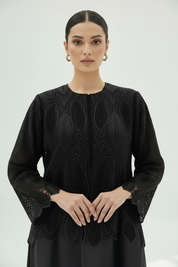 Centered close-up of beaded abaya detail