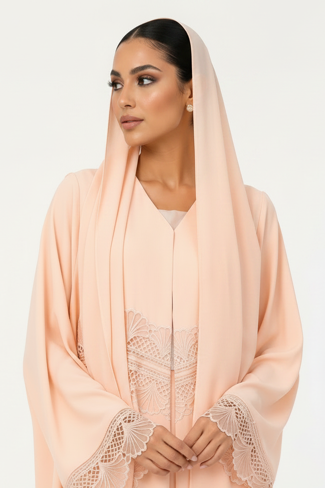 peach-abaya-with-longer-sheila-behind-hands.png