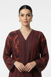 Waist up close-up of Arab model in burgundy printed abaya